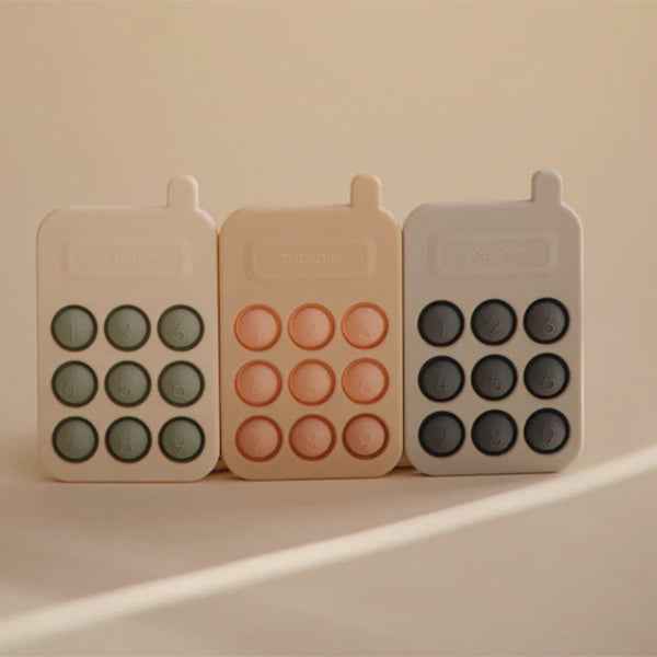 Mushie Pop It Toy Phone Blush
