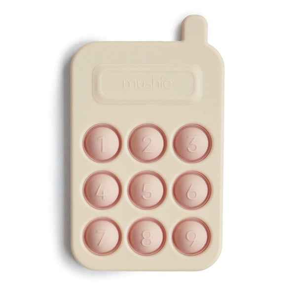 Mushie Pop It toy phone Blush